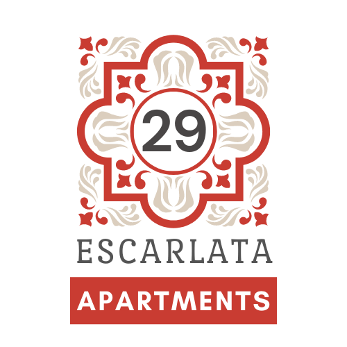A sign for 29 Escarlata Apartments with a decorative border.